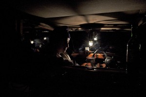 A late-night session with Oliver in the Rolls.  The boat was moored to the banks of the Brahmaputra, and the back of the Rolls became the drawing room.  It was the only comfortable place on board.
