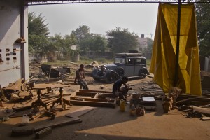Crossing the hot plains of Gujerat to Rajasthan the wooden frame of the Rolls shrank, and on the rough roads of the Thar Desert nuts unscrewed from their bolts.  Parts fell off.   I spent a day here working with the carpenters to fix the damage.